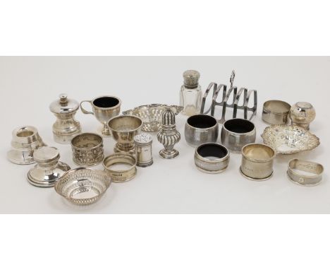 A group of silver cruets and oddments, comprising: a pepperette, Birmingham, 1902, E S Barnsley & Co (Edward Souter Barnsley)