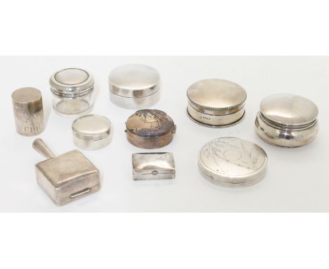 A group of nine pill boxes, comprising: a silver box, London, 1988, Ari D Norman, of circular form, the hinged cover repousse