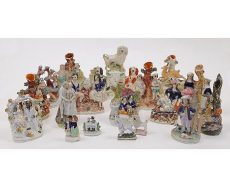 A group of Staffordshire ceramic figures and figure groups, 19th century, comprising: a group of three King Charles spaniels,