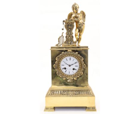 A French Empire style brass mantel clock, 19th century, the case modelled with a winged cherub leaning against an ornate colu