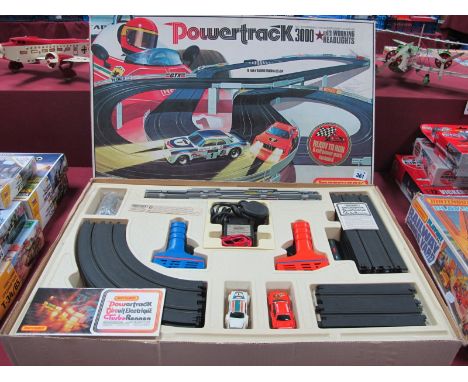 A 1978 Matchbox 'Powertrack 3000', with working headlights set, comprising Jaguar and BMW cars, although playworn set appears