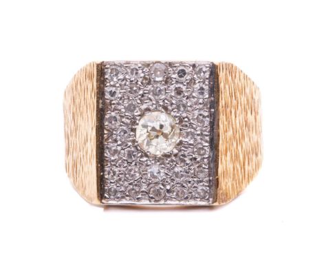 A diamond-set panel ring, the rectangular plaque centred with an old-cut diamond circa 0.30ct, set within rows of round-cut d