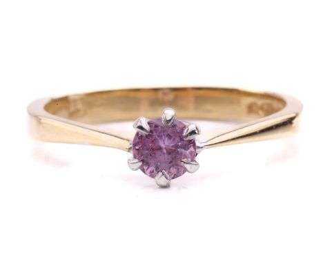 A pink sapphire ring in 18ct gold, composed of a circular-cut pink sapphire of 4.5 mm, in a six-claws setting with tapered sh