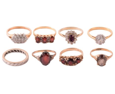 A collection of gem-set rings, including a diamond eternity ring with hallmarks for 18ct gold, ring size P 1/2, a garnet and 