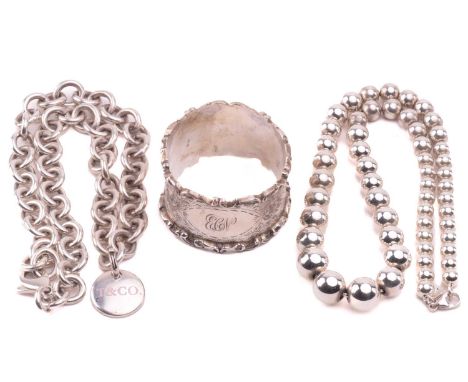 Two Tiffany &amp; Co. silver necklaces and a napkin ring; the Tiffany Hardwear graduated ball necklace, composed of 6mm to 11