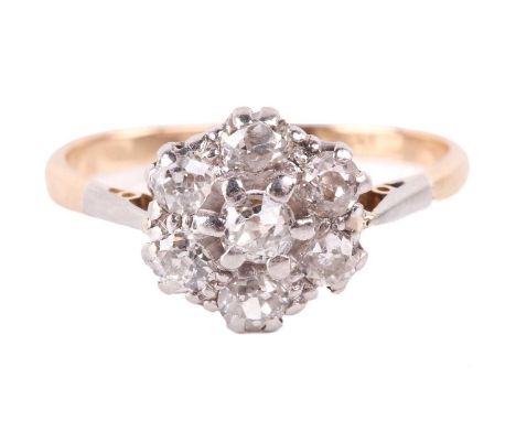 A diamond daisy head cluster ring, featuring seven old-cut diamonds of 2.5 mm in pavé-setting, tapered shoulders to a D-secti