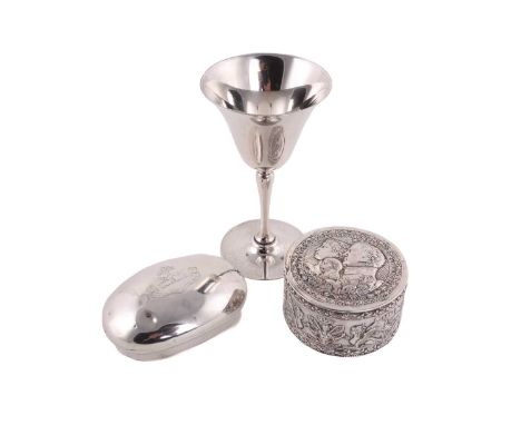 A silver goblet by Mappin and Webb, together with a silver oval snuff box engraved with a crest, Birmingham 1907 and a white 