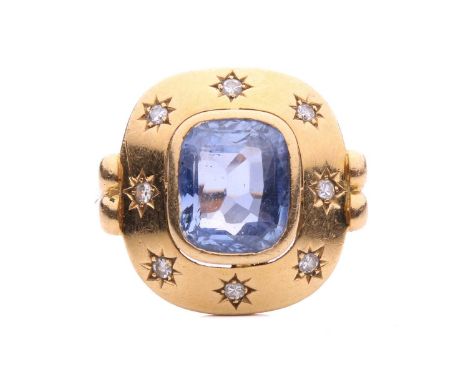 A sapphire and diamond dress ring, centred with a cushion-shaped sapphire of 9.9 x 8.3 x 5.0 mm, with light purplish-blue bod