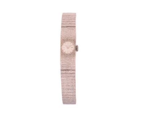 A Jean Renet 9ct gold lady's dress watch, featuring a Swiss-made hand-wound movement in a white metal case hallmarked 9ct gol