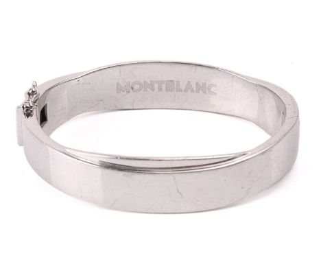 Montblanc - a silver hinged bangle, with an overlapped design, fastened with a tongue clasp and figure-of-eight safety catch,