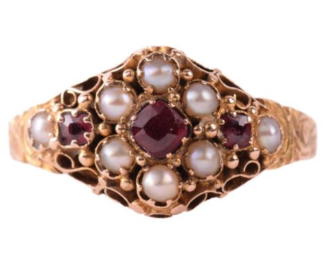 A Victorian gem-set dress ring in 15ct yellow gold, comprising a seed pearl and faceted pink paste cluster in an intricate sc