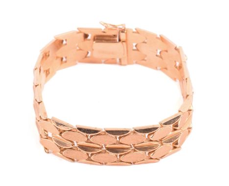 A fancy link bracelet of ovoid design, with two rows of hinged links in Florentine finish, completed with a concealed tongue 