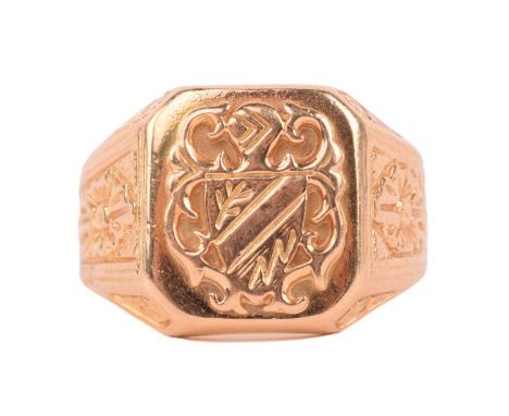 A signet ring of heraldic design, with floral engraved shoulders to a flat shank, rubbed-off Italian assay marks, testing 18c
