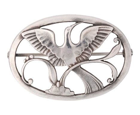 Georg Jensen - a Bird of Paradise openwork brooch, depicting a bird spreading wings amongst the foliage in an oval frame, hin