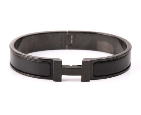 Hermès - a narrow 'Clic HH So Black' bracelet with matte enamel and plated hardware, signed and marked, inner diameter measur