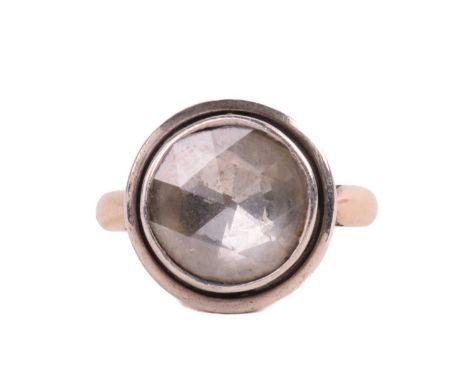 A solitaire rose cut diamond ring, the diamond measuring 10.8mm diameter, foil backed in a closed back setting, ring size N 1