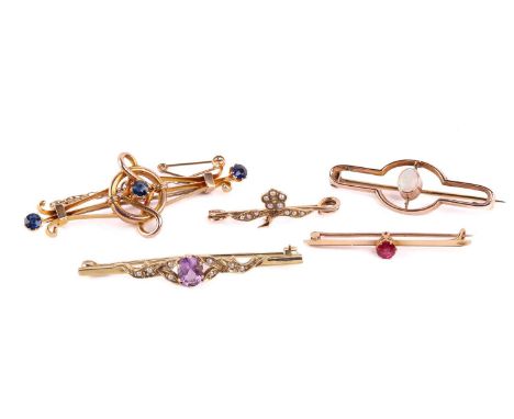 A late Victorian three stone sapphire brooch set along a scrolling three bar frame, (unmarked); together with a single stone 