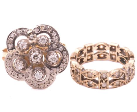 A diamond flowerhead ring and another; the cluster ring claw-set with six brilliant-cut diamonds, in a flowerhead surround en