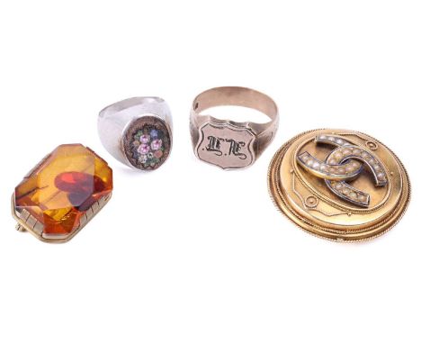 Two brooches, a signet ring and another; including a Victorian brooch with applied intertwined horseshoes, and twisted cable 