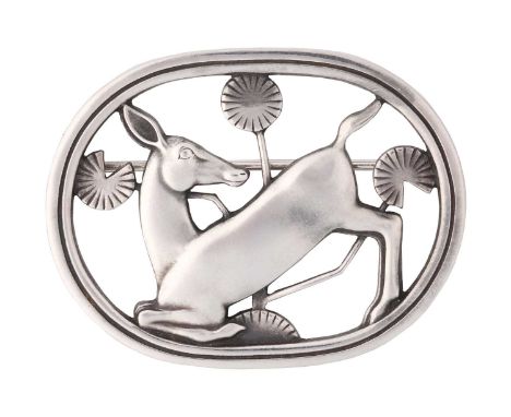 Georg Jensen - A brooch depicting kneeling fawn and flowers, fitted with hinged pin stem and roll-over safety catch, designed