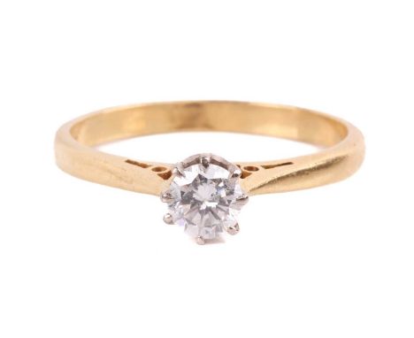 A diamond solitaire ring set with a round brilliant cut diamond with an estimated weight of 0.35ct in a claw setting to a gol
