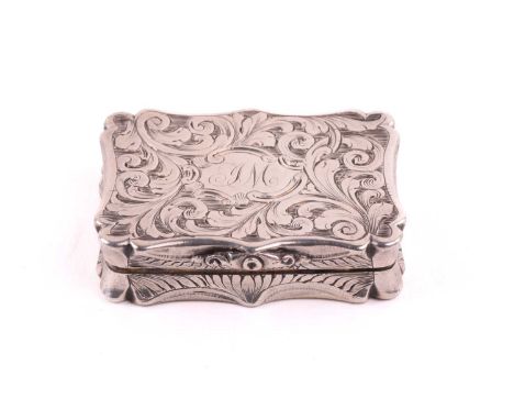 A Victorian silver vinaigrette, by Nathaniel Mills, Birmingham 1842, of waisted rectangular form, engraved with scrolling fol