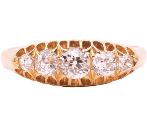 A diamond ring set with a graduated row of old cut diamonds with a total estimated weight of 0.90cts, in claw settings, to an