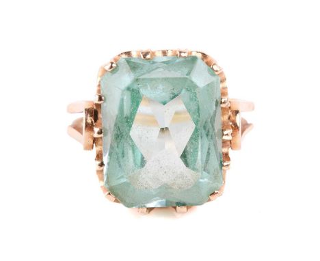A green synthetic spinel cocktail ring, composed of an octagonal synthetic spinel of light green colour, approximately measur
