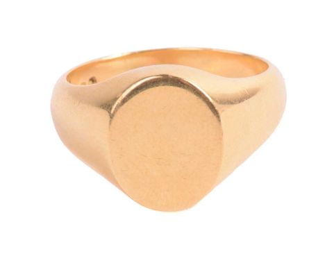 A signet ring, with a vacant oval ring head, leading to a tapered D-section shank, South African springbok hallmarks for 18ct
