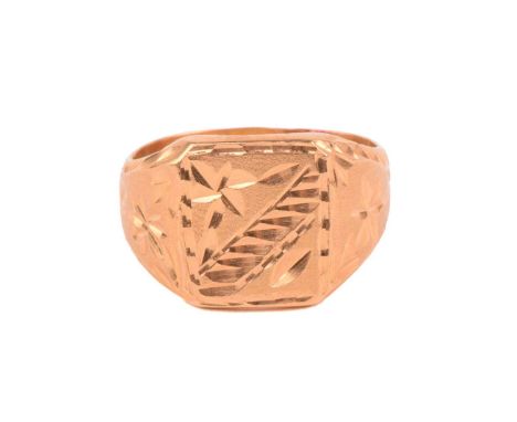 A signet ring of floral design, the rectangular ring head and shoulders engraved with bright-cut floral motifs on a textured 