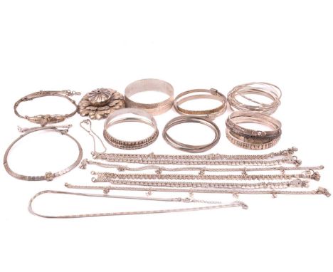 A collection of jewellery in white metal, including a hallmarked silver necklace, hallmarked silver bangle, Indian jewellery 