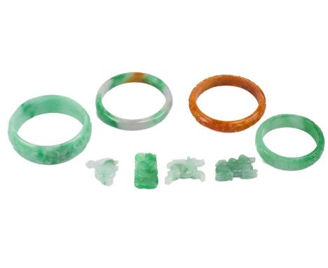 A mixed collection of Chinese jade, including four closed bangles and four carved pendants of Chinese zodiac motifs. (8)