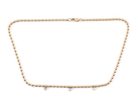 A ball chain necklace with diamond charms, suspended with three 3.0 mm brilliant-cut diamonds in collets, with an estimated t