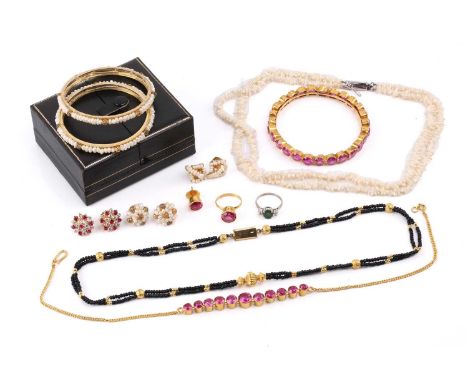 A pink synthetic sapphire suite in gold plated metal, comprising a necklace, bangle, ring and earrings, a pair of cluster ear