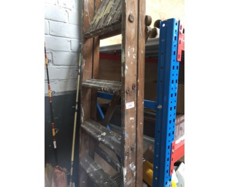 A SET OF WOODEN STEP LADDERS