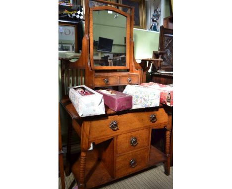 An Arts &amp; Crafts design oak dressing chest on bobbin turned &amp; block supports
