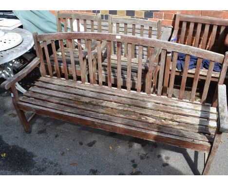 A three piece garden suite slatted teak construction, three person bench and two armchairs