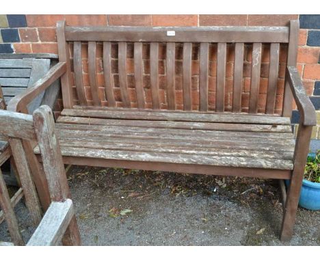 A slat built two person garden bench