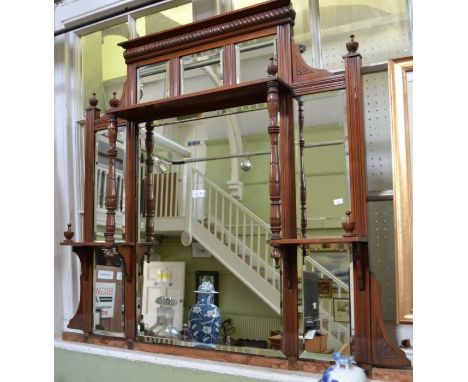 An Edwardian mahogany framed multi bevelled mirror backed display shelf