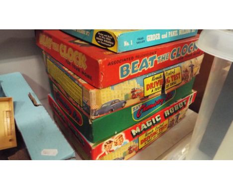 A selection of vintage games to include Chemistry Set, Beat The Clock and Magic Robot etc