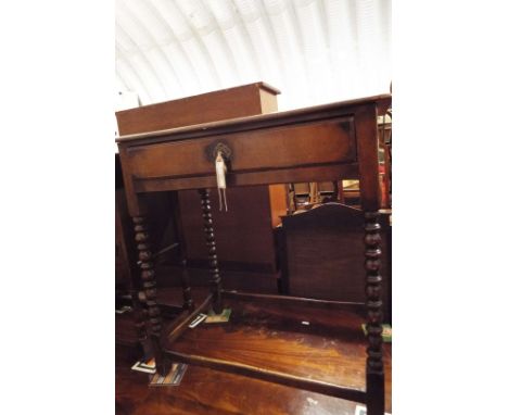 A 19thC walnut side table fitted with single frieze drawer with brass drop handle and raised on bobbin turned supports and cr