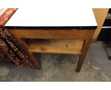 An enamel topped kitchen side table