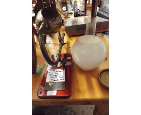 A ships lamp having brass bowl and fitting with glass shade and funnel, with brass plaque from the S.Y. Argonaut Sunk of Dung