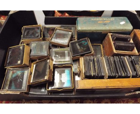 A collection of over 200 early glass magic lantern slides depicting religious and fable scenes, mainly coloured with mostly s