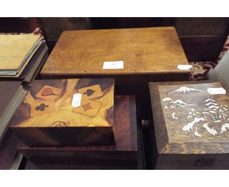 Four treen boxes and an oak tea caddy having Mount Fuji decoration