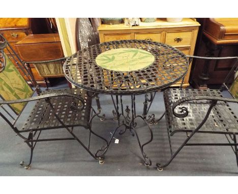 A good quality antiqued metal lattice garden table with central floral panel together with two floral scrolling matching chai