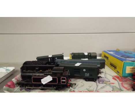 Various OO gauge engines and trucks to include a Bachmann shunter, a Hornby tank engine number R52, a 'Dock Authority' shunte