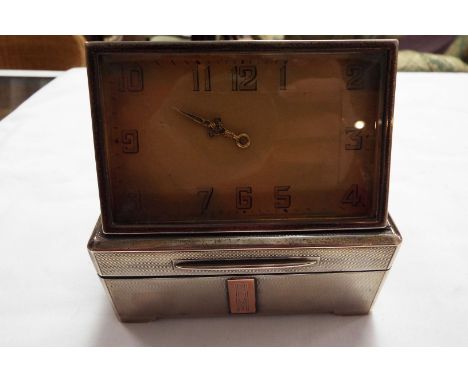 A rare London 1930 silver Dunhill of London compendium combined cigarette case with clock, lighter and a pair of ashtrays wit