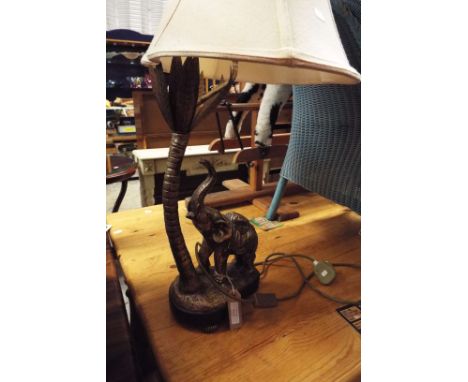 A modern gilt table lamp in the form of an elephant and palm tree