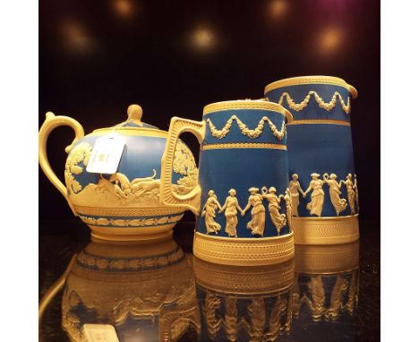 A 19thC Copeland Spode Jasper ware teapot moulded in relief with hunting scenes and leaf and berry borders together with two 